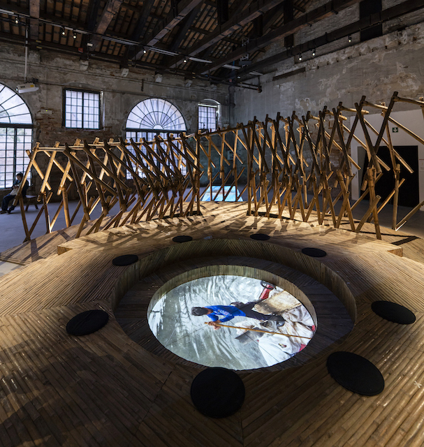 The center of the bamboo installation shows a video of the current state Tripa de Gallina
