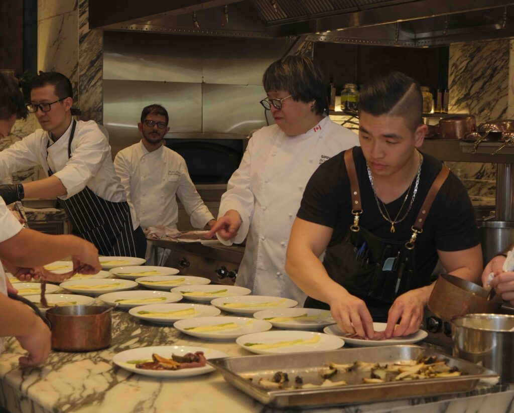 Chef Alvin Leung and his team plate 